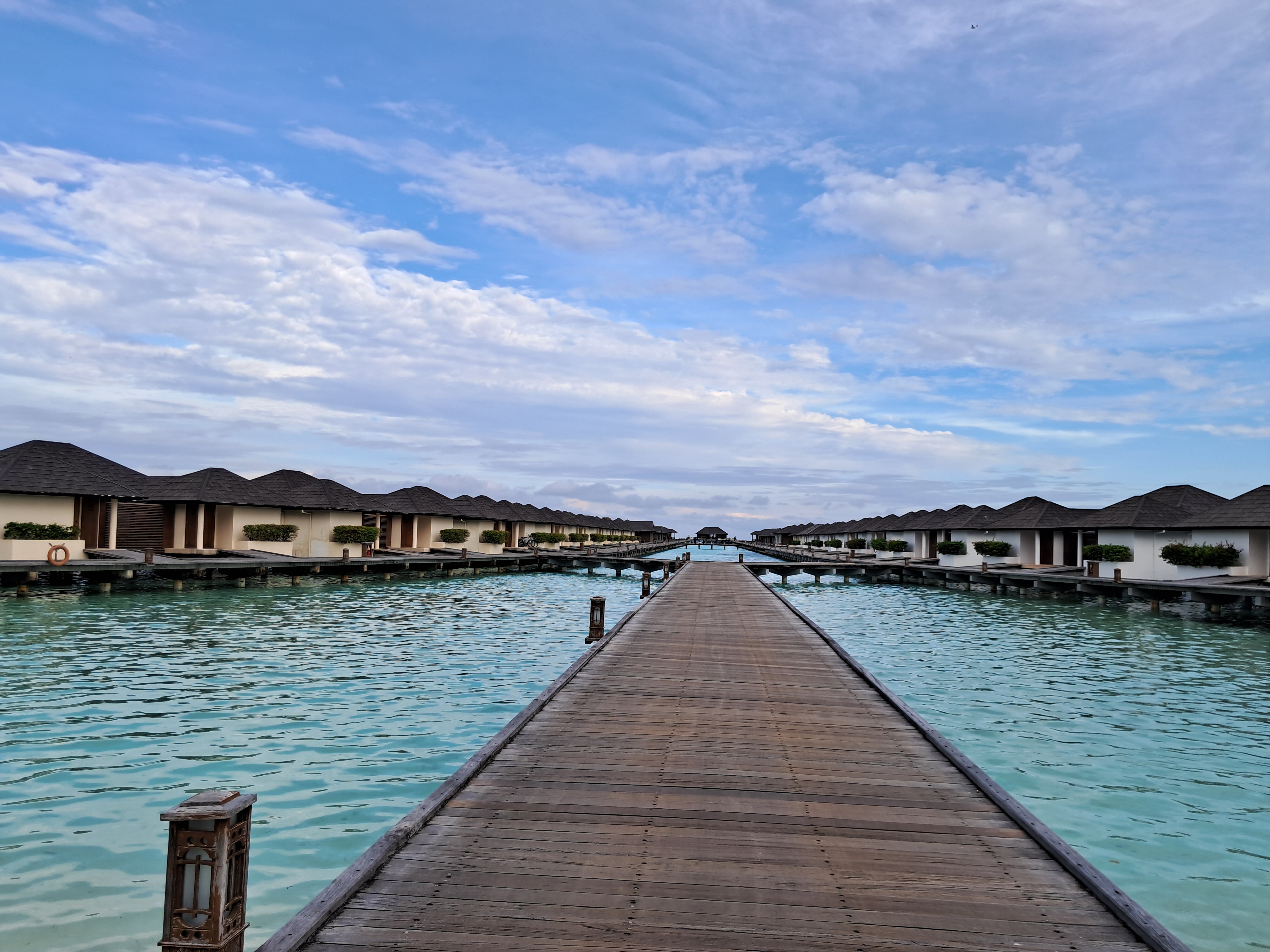 Water villas over a luminous turquoise lagoon
